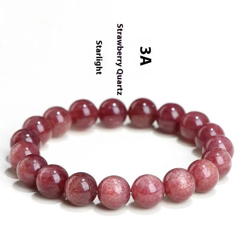 Natural cherry red strawberry quartz bracelet with geometry-shaped beads on a white background.