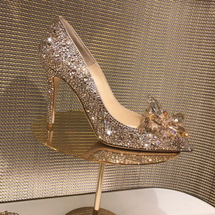 Women's gold high heels with pointed toes, rhinestone decoration, and stiletto heel