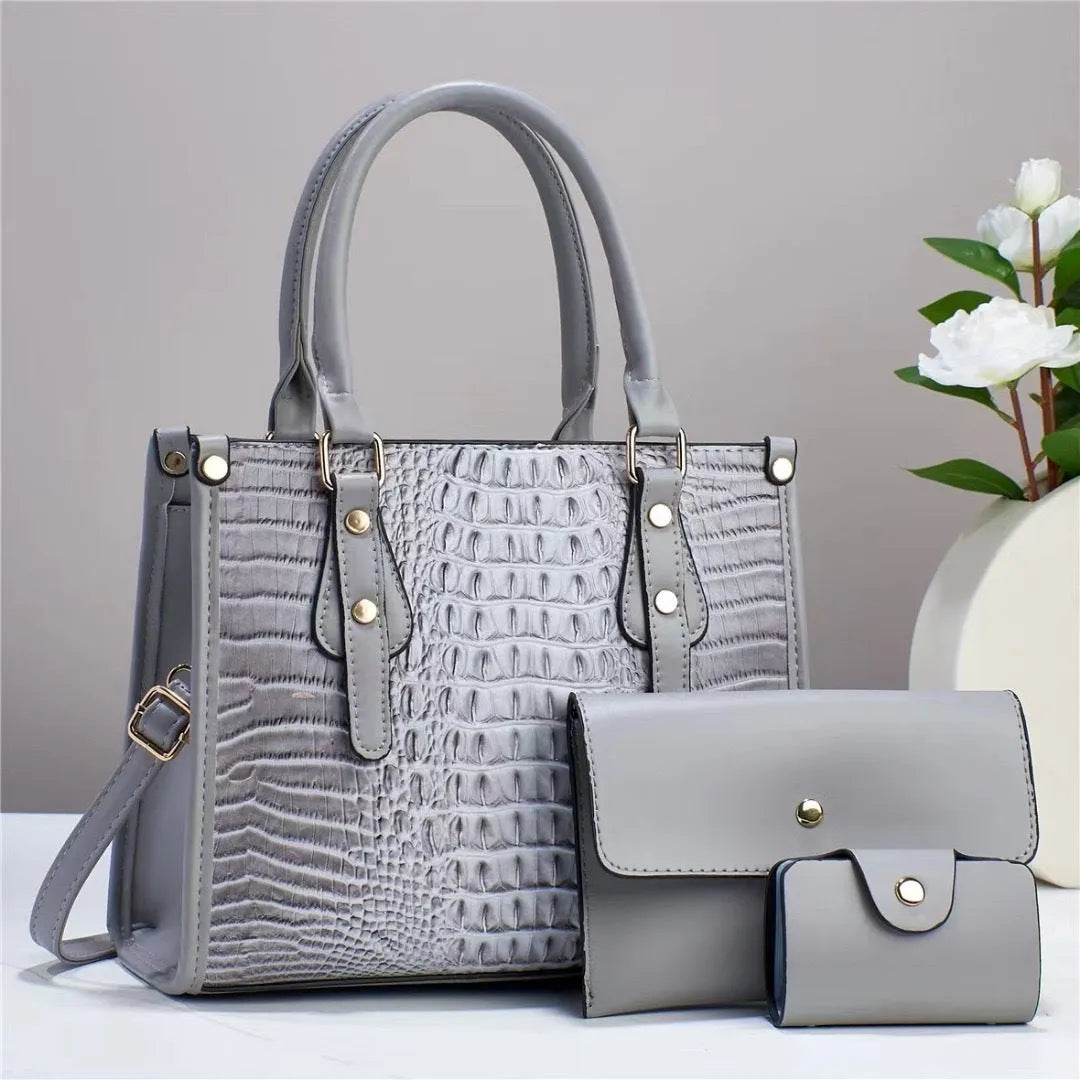 Women's burgundy PU leather bucket crossbody bag set with matching wallet and card holder.