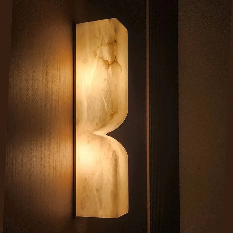 Copper wall-mounted lamp strip with warm light illumination in Nordic design