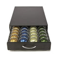 Black coffee capsule storage drawer with silver handle on a cafe countertop