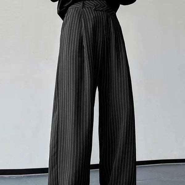 Black men's casual trousers with vertical stripes and pleated design on mannequin