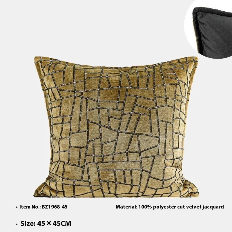 Gold geometric pattern decorative cushion cover shown in square and waist pillow sizes on a grey sofa.