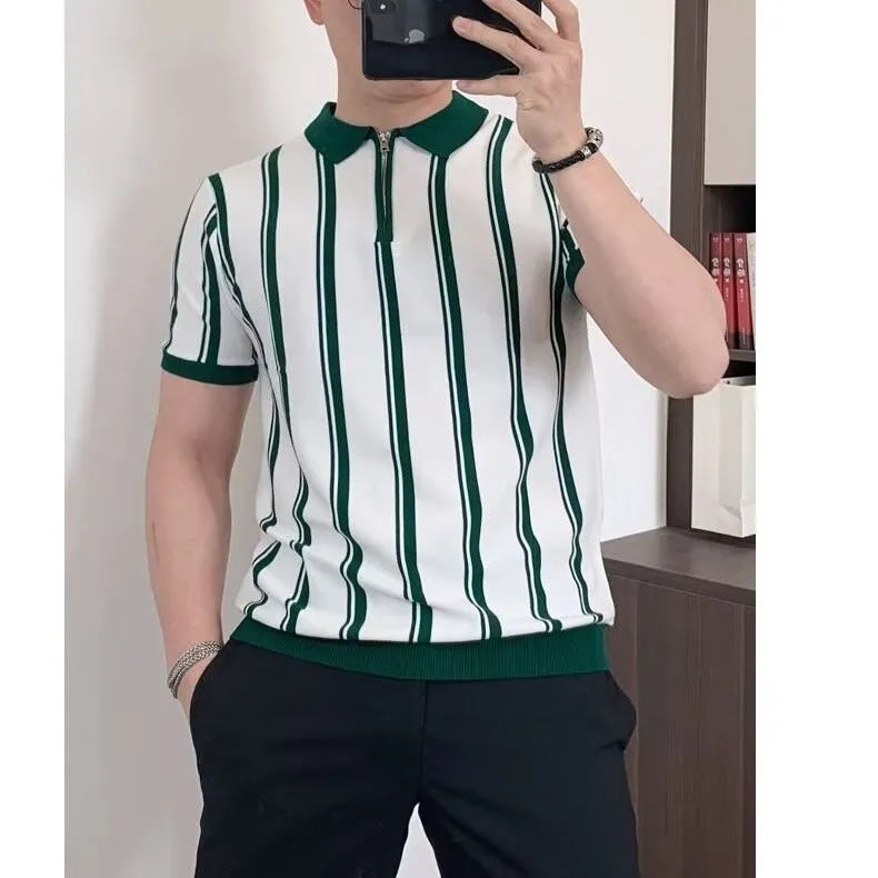 Man wearing a black and white vintage stripe T-shirt with a silver front zipper and cartoon graphic.