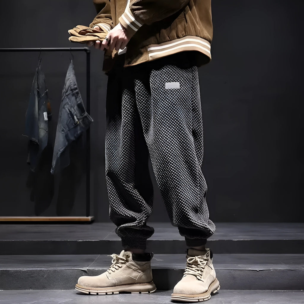 Grey men's straight-leg sweatpants with an ankle tie fastening on the hem.