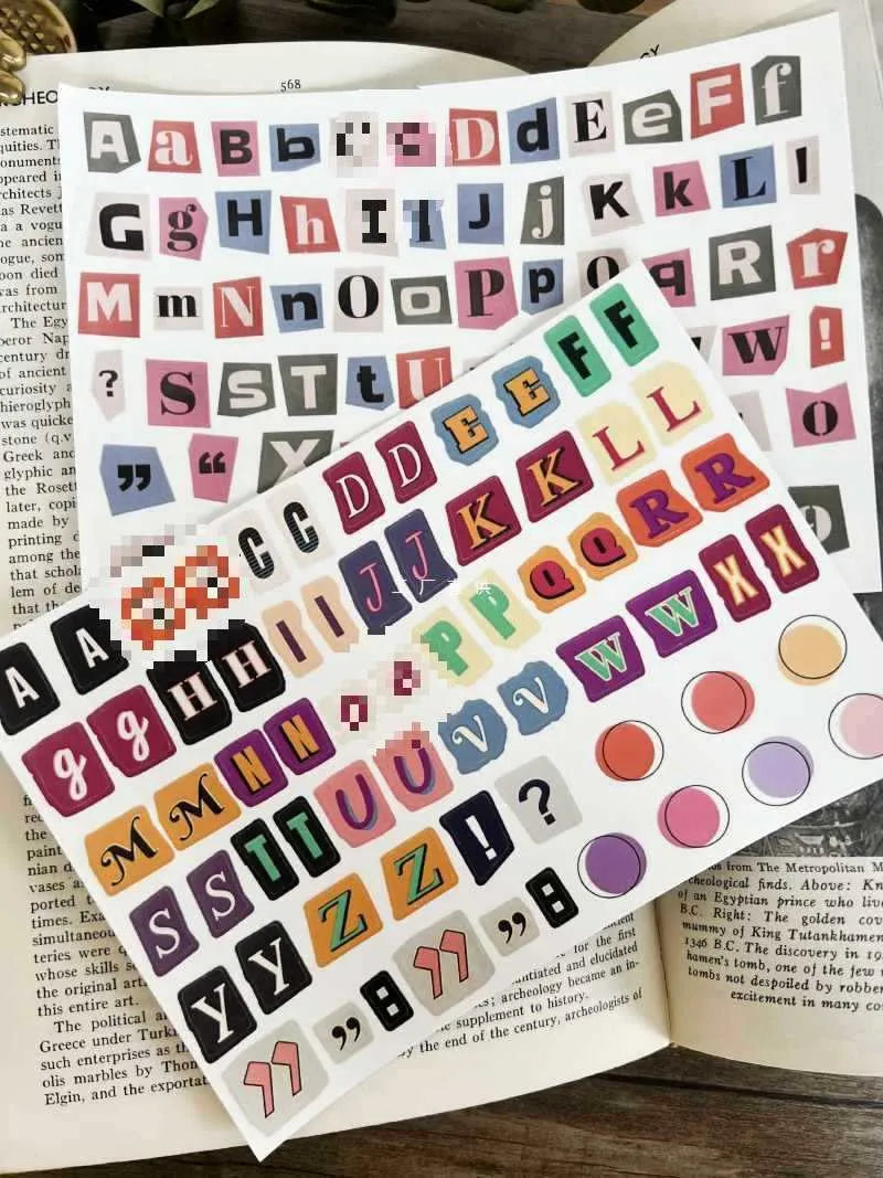 Decorative sticker sets showing English letters, numbers, and week words in colourful printed designs for crafting and labelling