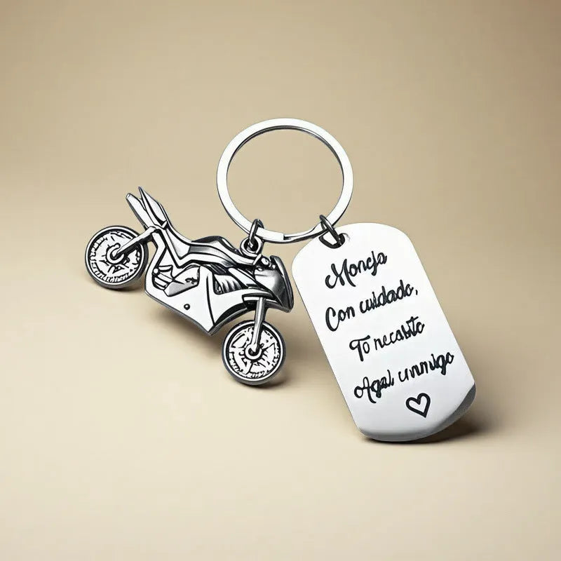 Stainless steel motorcycle keychain with a modern minimalist design, shown with a velvet flannel bag.