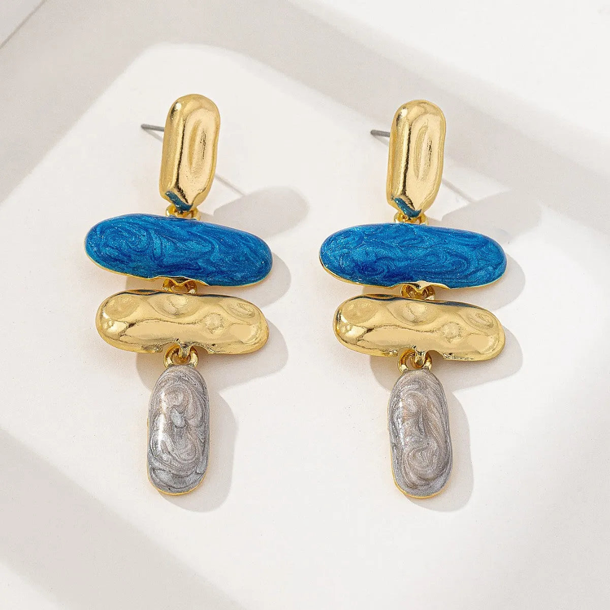 Geometric shaped stud earrings with multicolour electroplated finish on zinc alloy