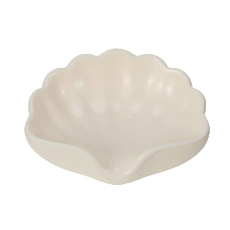 Plastic shell-shaped soap dish in pearl white colour with drainage design for bathroom use