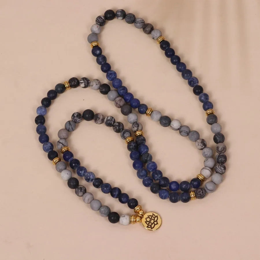 Blue patterned network stone beads on a multi layer alloy chain bracelet