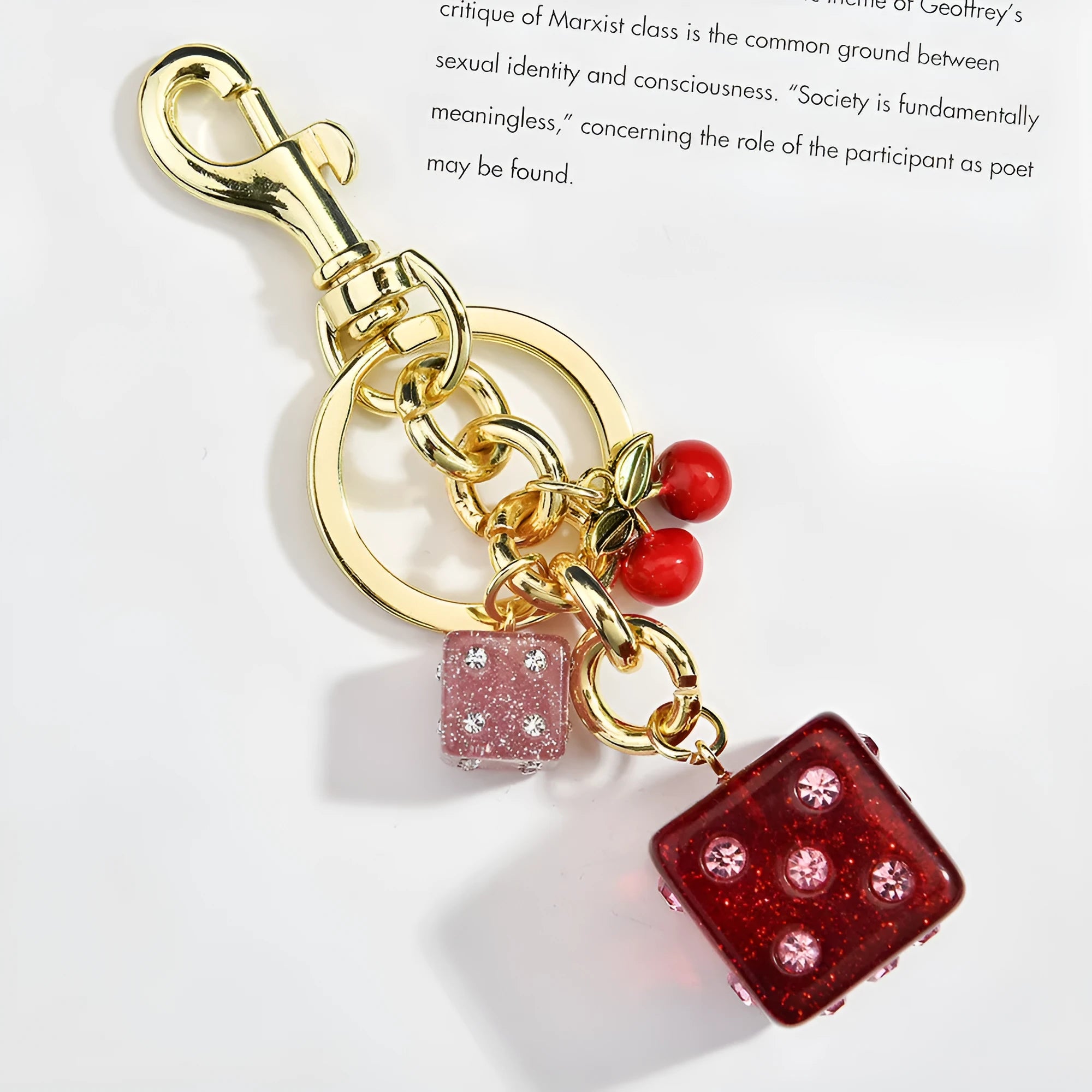 Vintage cherry red two-tone dice pendant on a metal keychain, a retro suitcase ornament.