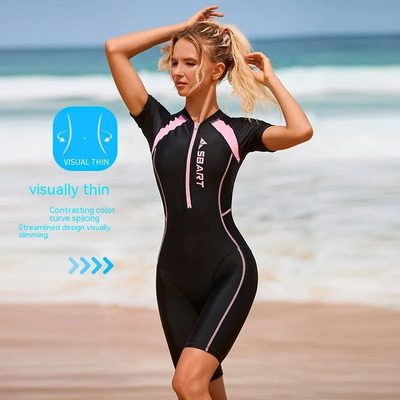 Solid colour women's one-piece swimsuit with short sleeves and a built-in chest pad.