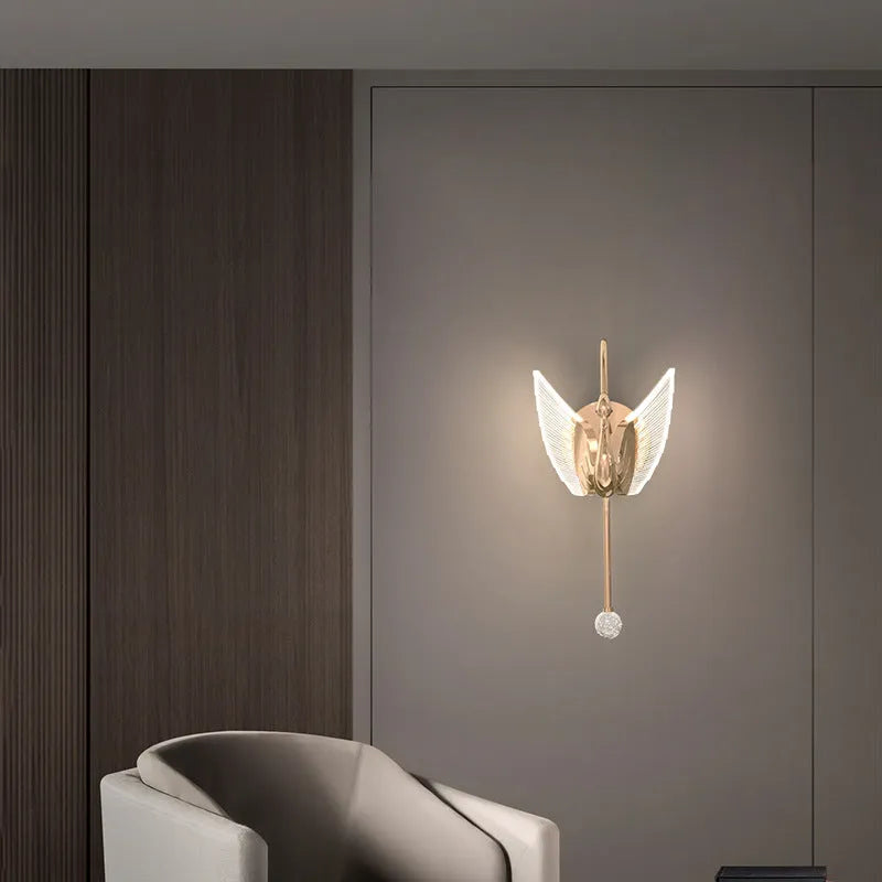 Gold swan design wall lamp with acrylic shade showing LED lighting and iron construction