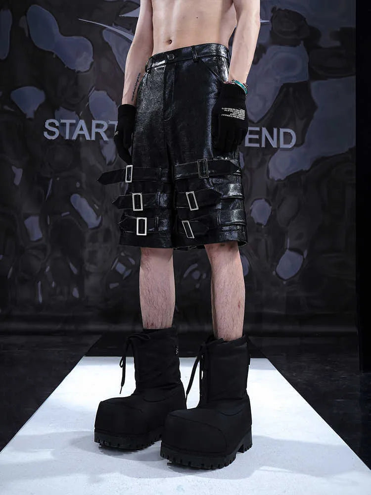 Men's black casual cropped pants with leather ring detailing on PU leather sections