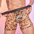 Men's leopard print boxer shorts laid flat, showing elasticated waistband and animal pattern.