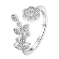 Gold and white copper open ring with diamond-finished flower and leaf design for women.