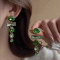 Geometric Chinese style earrings with retro green gradient colour and tassel design