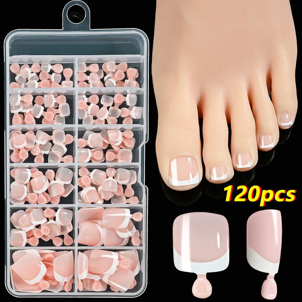 120-piece box of French white tip false toenails in nude colours, square short shape.