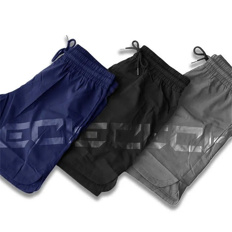 Men's black quick-dry elastic waist running shorts on a white background.
