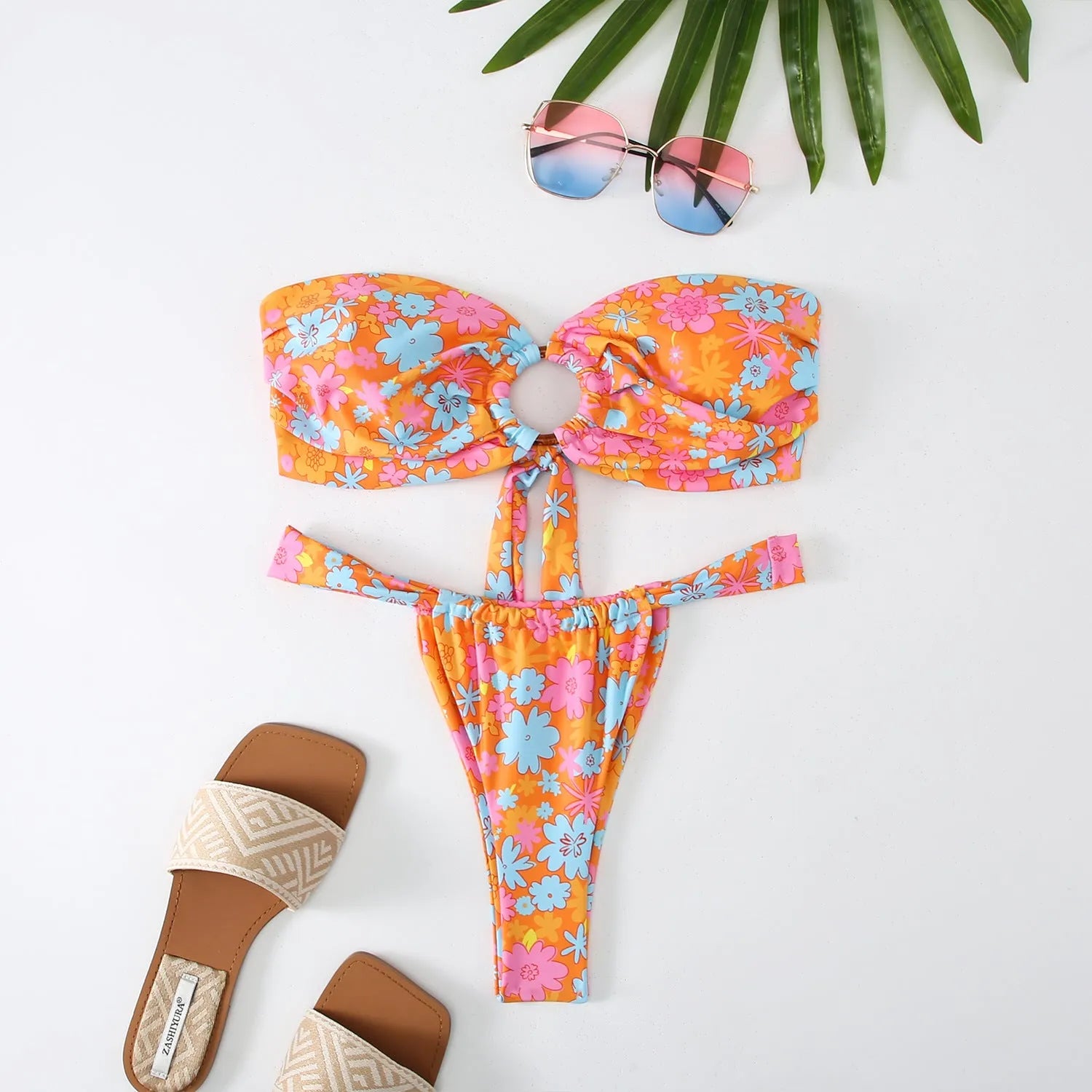 Women's floral print tube top ring bikini swimsuit set on mannequin