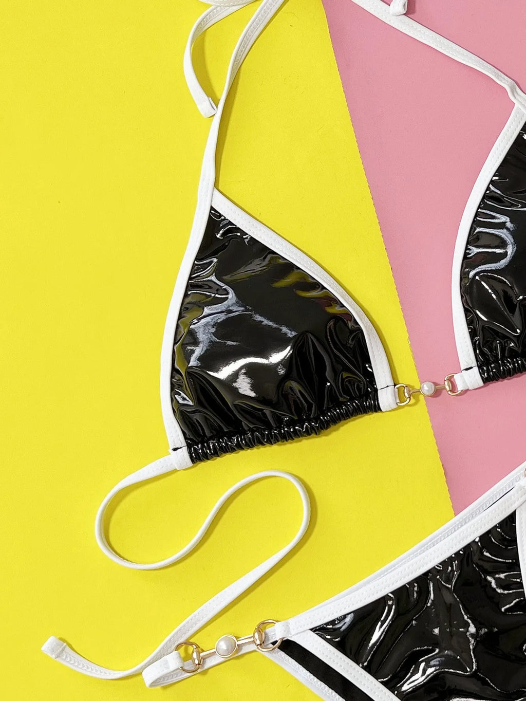 Black women's split bikini swimsuit with solid colour design and briefs style