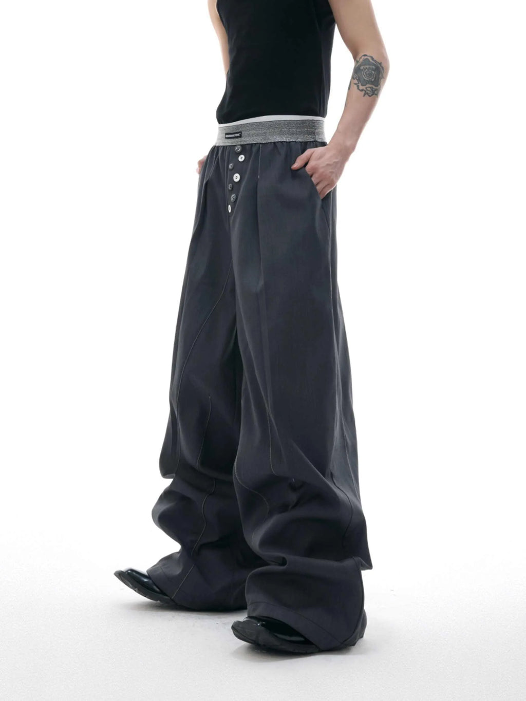 Straight-leg high-waist trousers with button open line detailing in black and grey colours