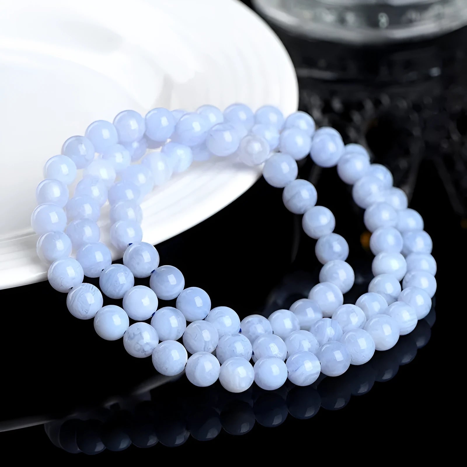 Blue agate bracelet with natural striped patterns on 6-6.8 mm beads in unisex design