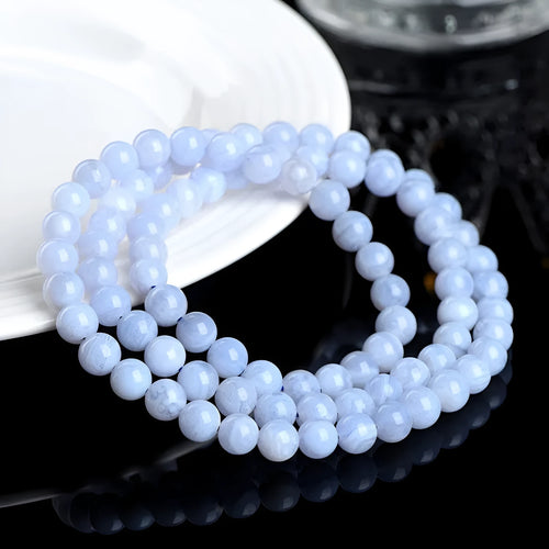 Blue agate bracelet with natural striped patterns on 6-6.8 mm beads in unisex design