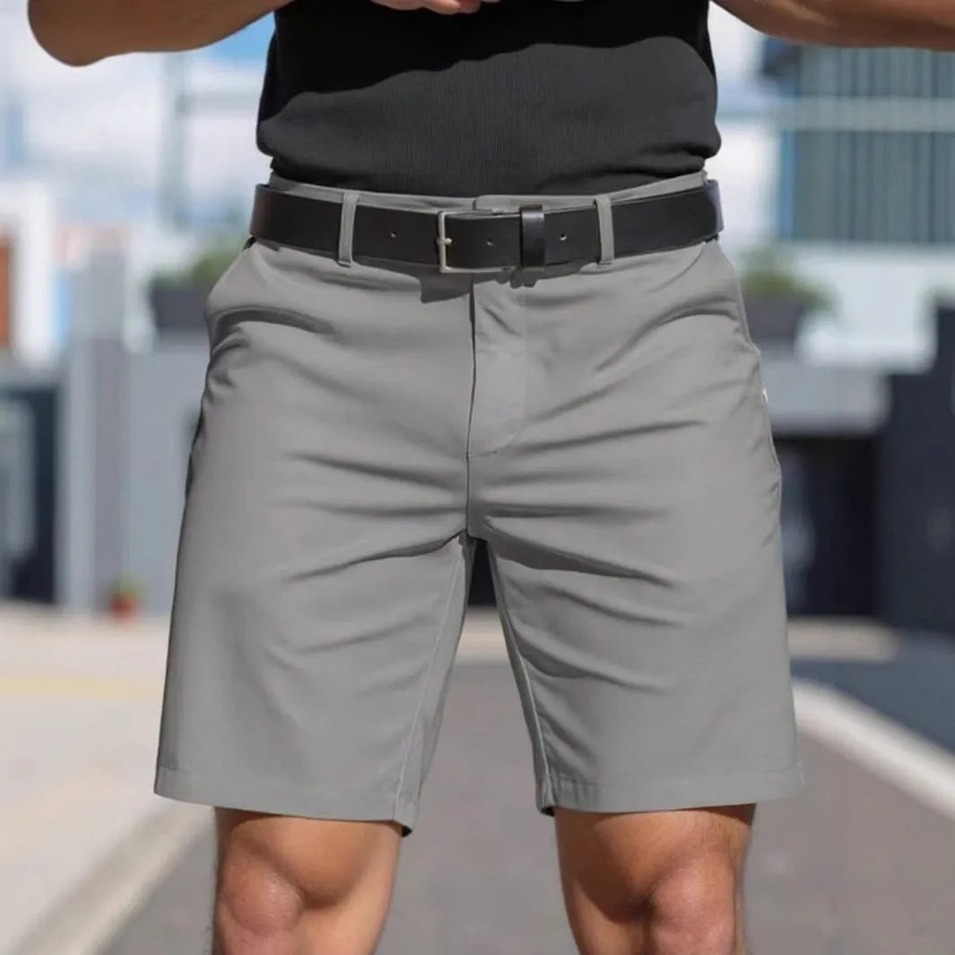 Men's solid colour straight-leg polyester shorts with micro elasticity, shown in apricot.