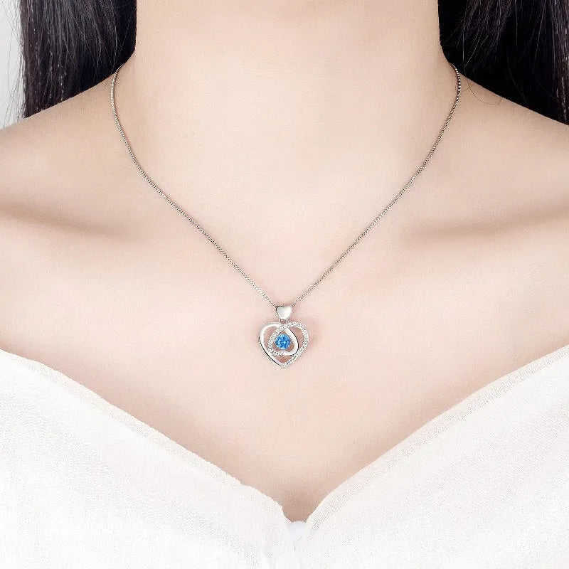 Blue diamond heart pendant necklace and matching bracelet jewellery set on copper