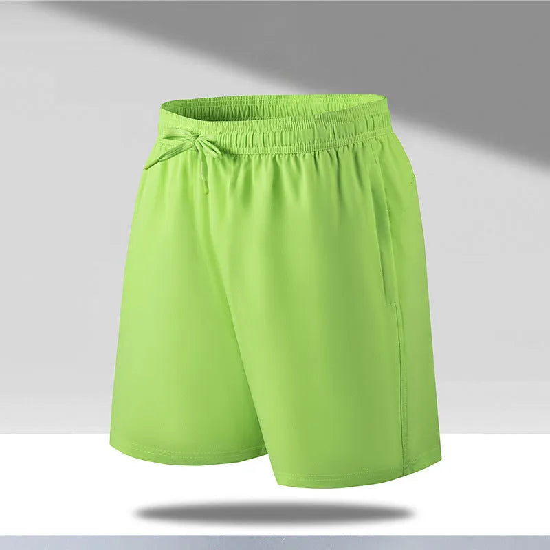 Man wearing loose black quick-dry sports shorts with an elastic waistband