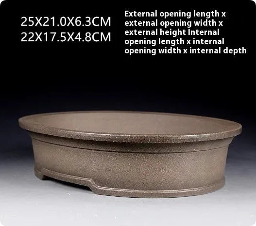 Handmade antique oval purple sand bonsai pot measuring 25x21x6.3cm