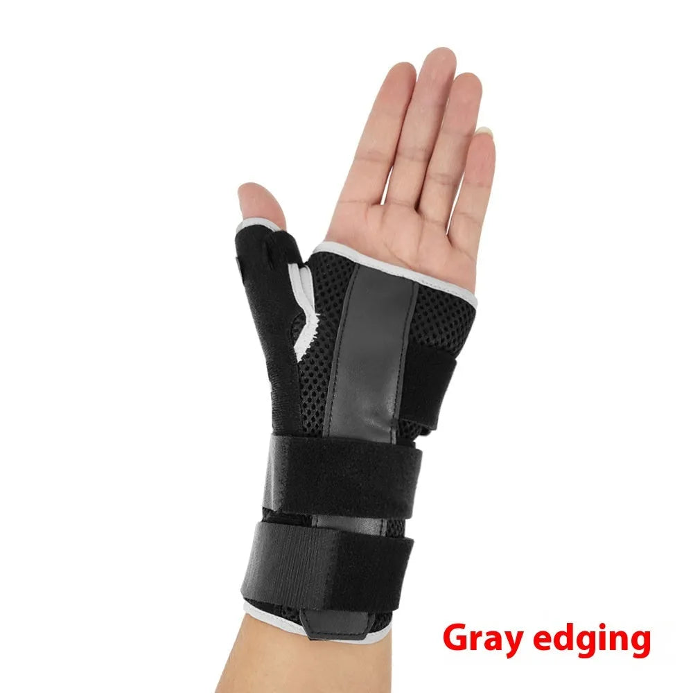 Black sports wrist guard with grey edging and a thumb strap, showing carbon fibre reinforcement panel.