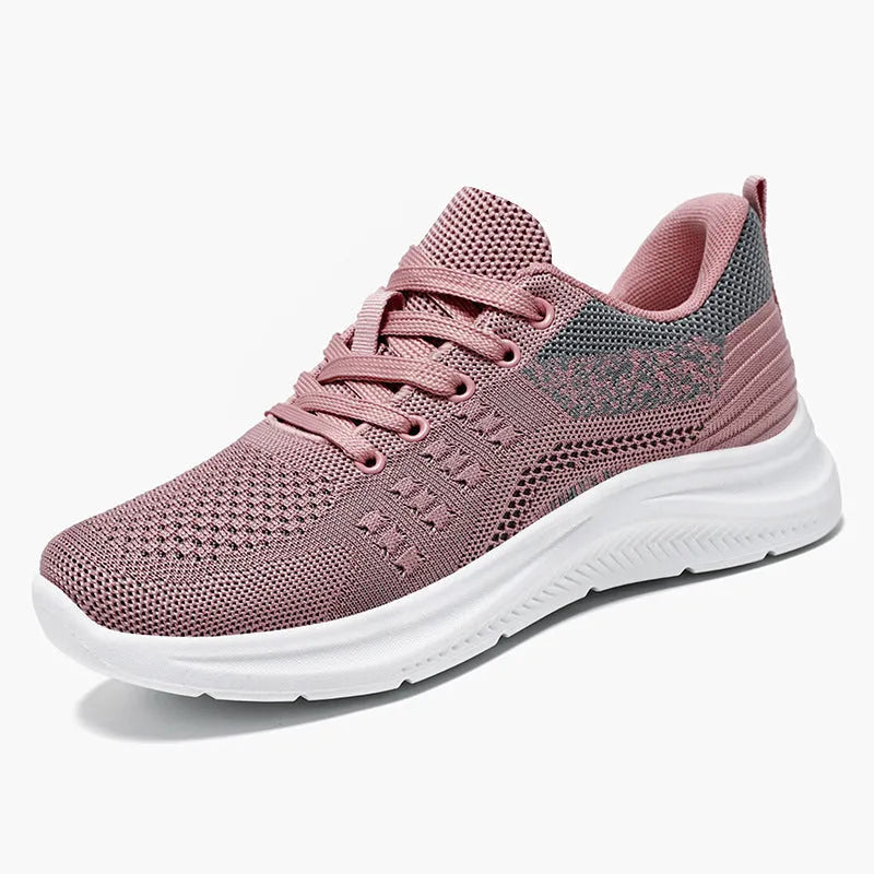 Women's low-top black mesh sneakers with round toe and white PVC sole, shown with lace-up front.