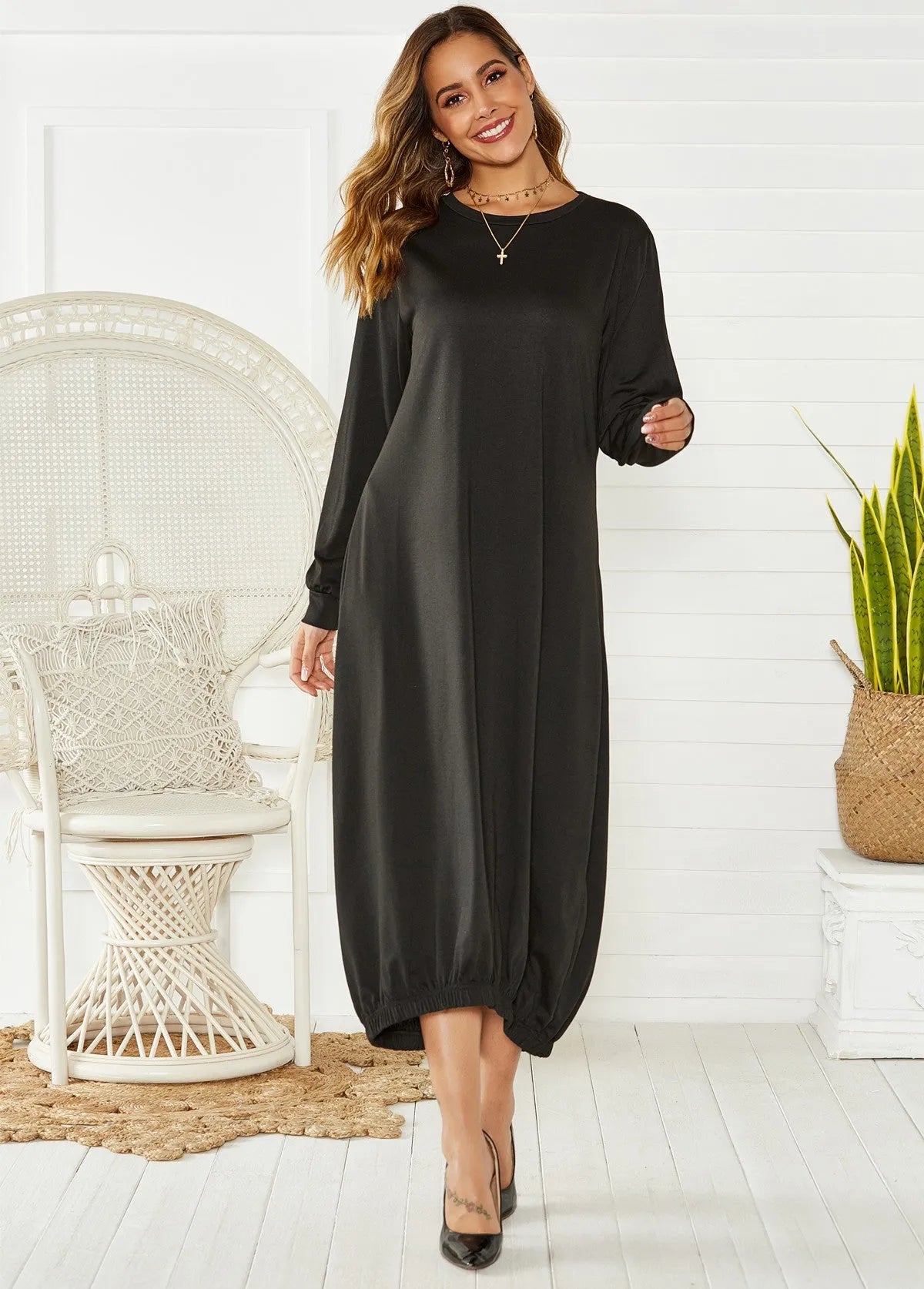 Women's black lantern dress with lace-up crew neck and loose silhouette