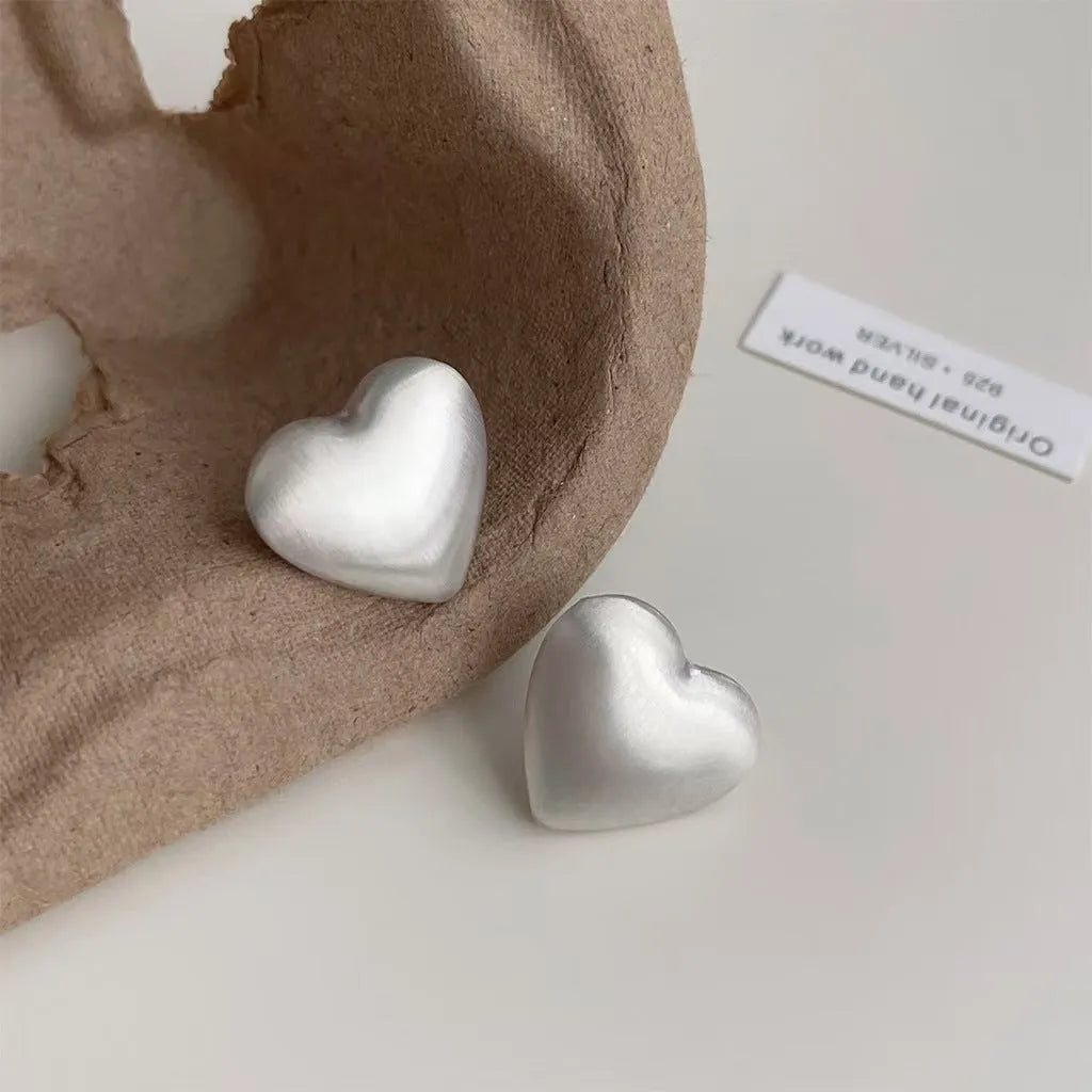 Love Pearl women's white pearl stud earrings with post-back fastening on white background