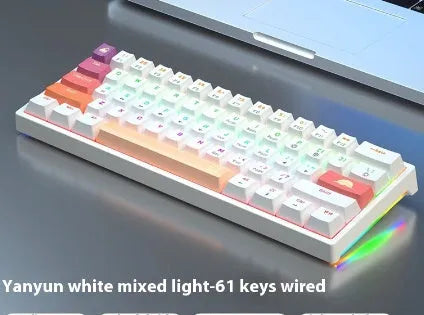 Small bluish-black 61-key mechanical keyboard with wired USB cable showing multiple switch colour options
