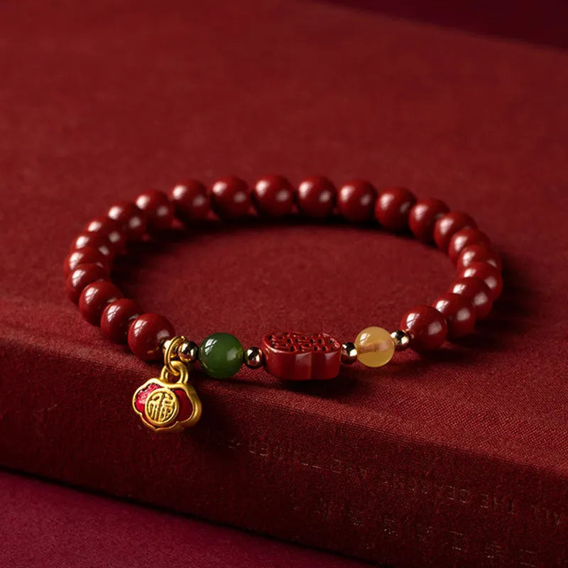 Cinnabar fu character bracelet with emperor sandstone beads in 6mm and 8mm size options.