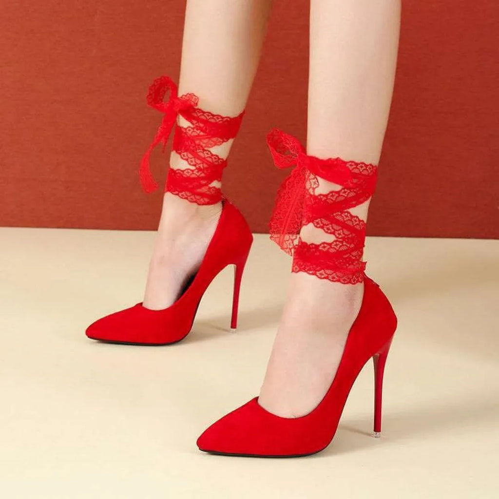 Black pointed toe stiletto shoe with shallow mouth design and a fabric strap with flat buckle