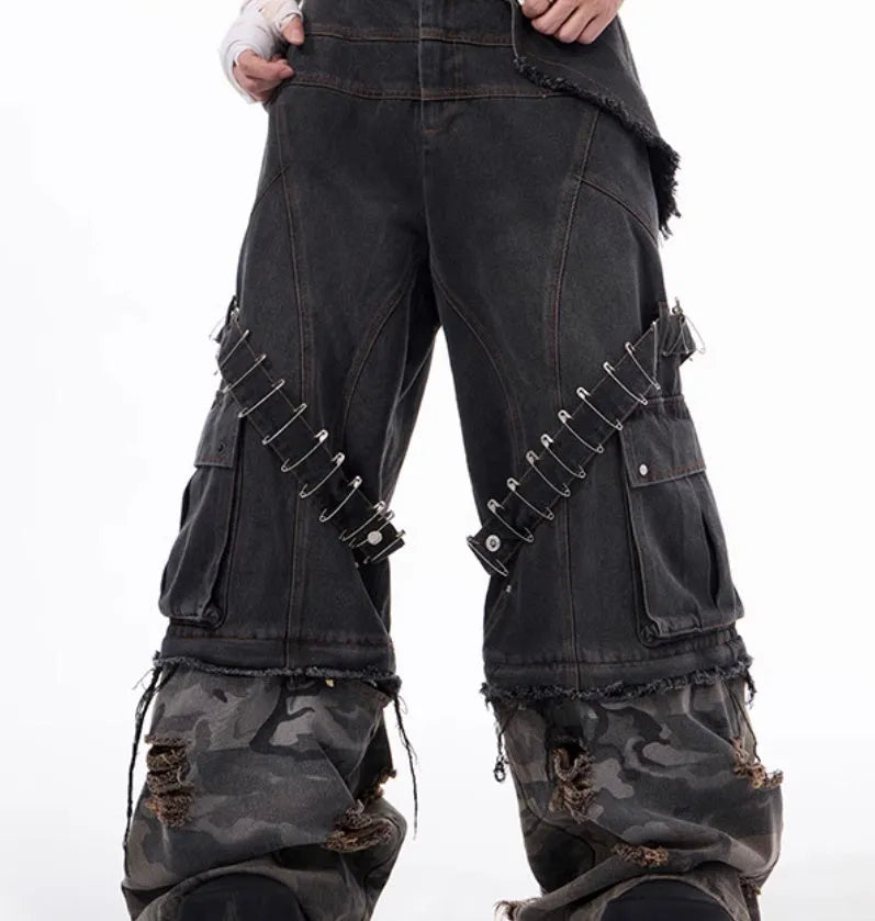 Grey men's camouflage print jeans with structural splicing and ribbon detailing on cotton denim.