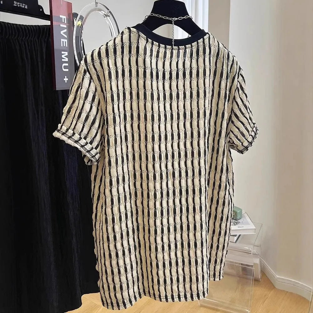 Men's black striped short sleeve shirt in loose silk-linen blend on hanger