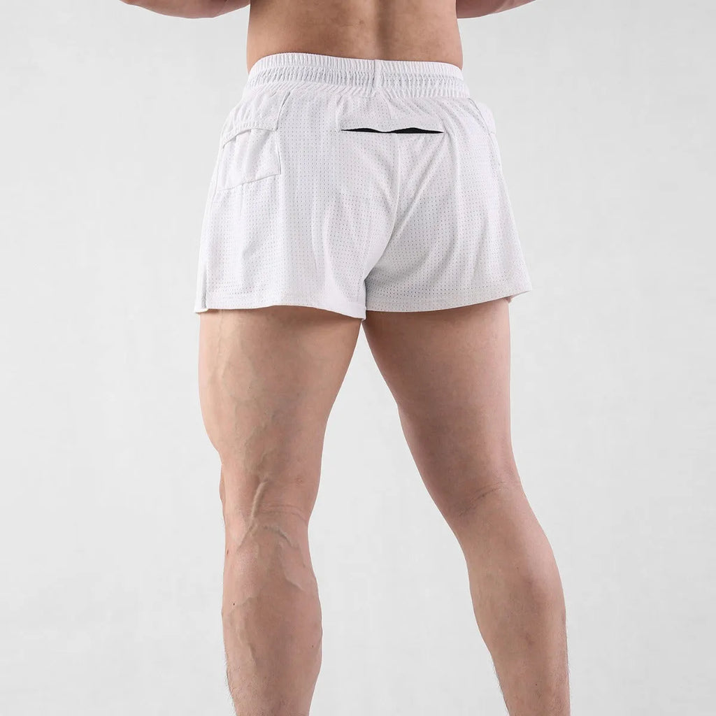 Man wearing black quick-dry nylon summer shorts, showing mid-waist sports leisure style.