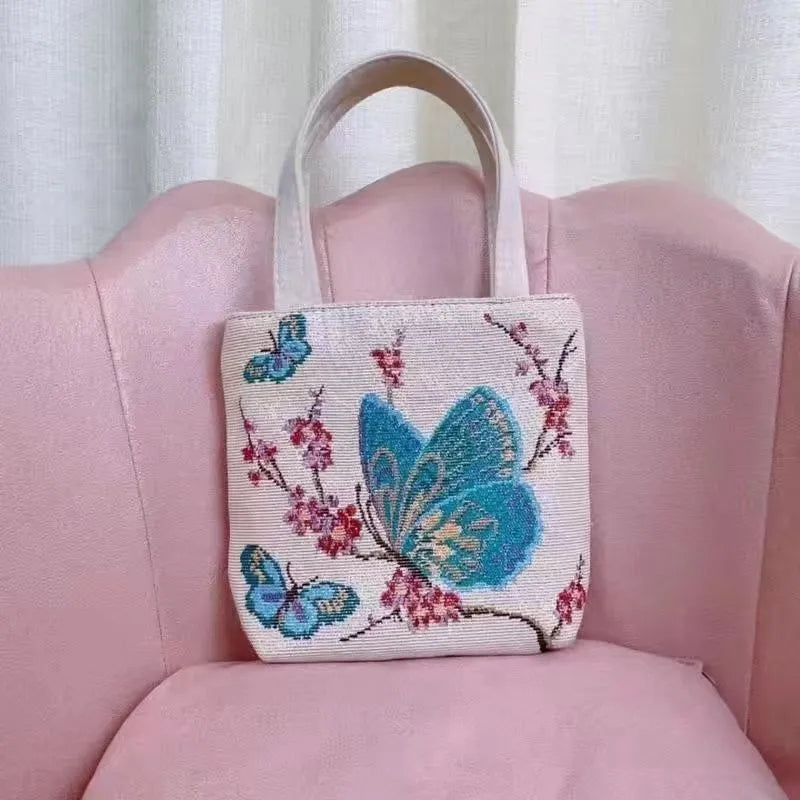 Canvas handbag with gold wire embroidery in floral and illustrative designs
