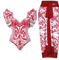 Women's printed one-piece swimsuit with a matching skirt cover-up in a rose pink floral pattern.