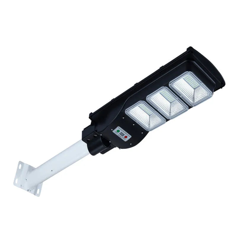 Integrated solar street light unit with solar panel and LED light in one housing