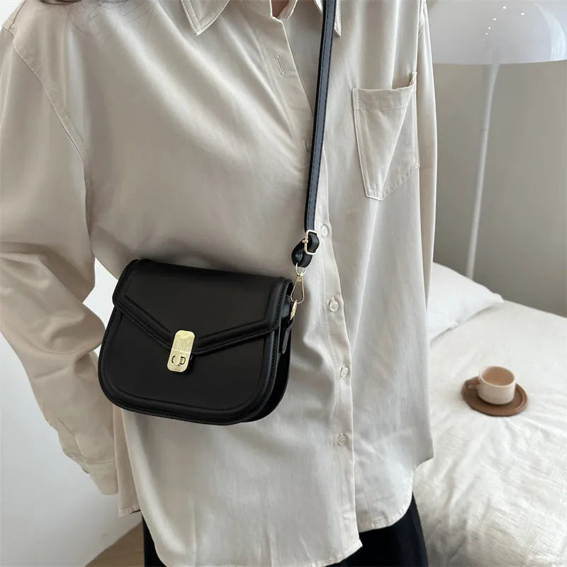 Soft textured PU leather messenger bag with clamshell opening, shown in a horizontal square shape.