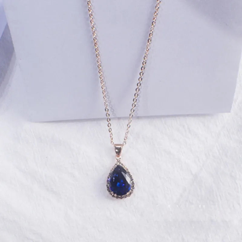 Rose gold plated drop pendant necklace with colourful rhinestones in a pink colour option.