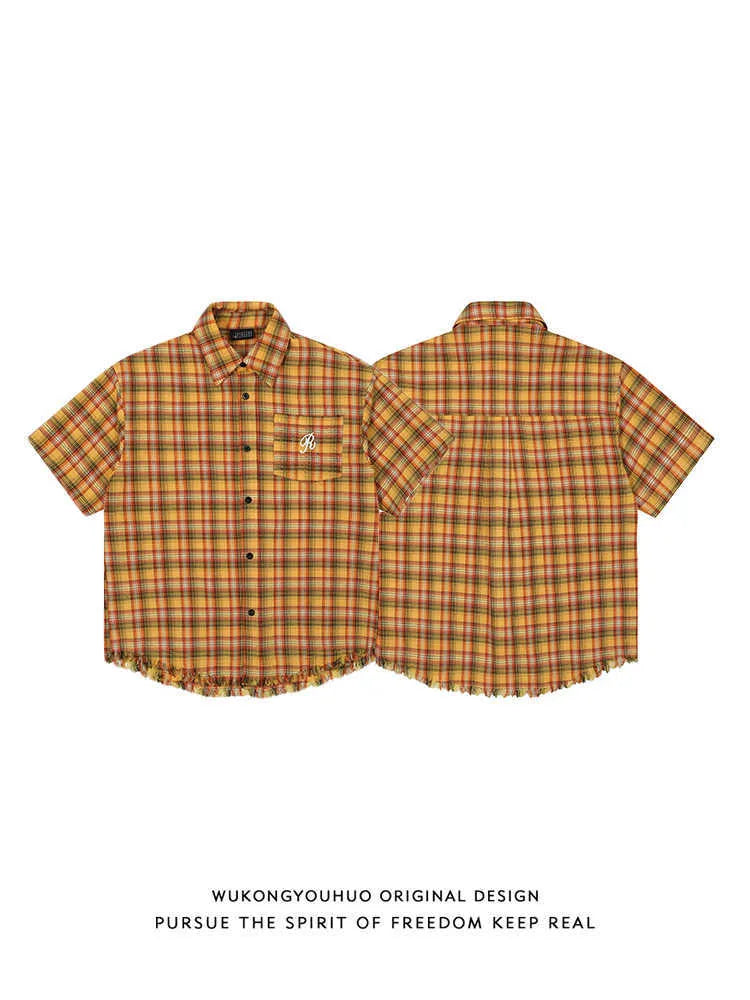 Yellow plaid short sleeve button-up shirt with chest pocket, loose fit unisex design