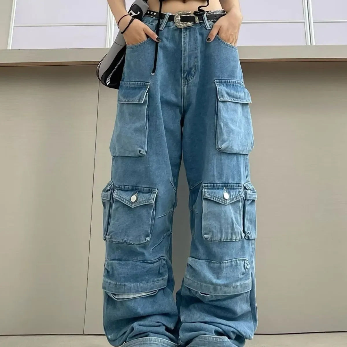 Women's high waist wide leg denim trousers with multiple pockets in tie-dyed blue colour