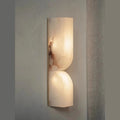 Copper wall-mounted lamp strip with warm light illumination in Nordic design